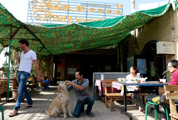 Chen Tao (center), runs the Pamir Youth Hostel in the center of the old town.