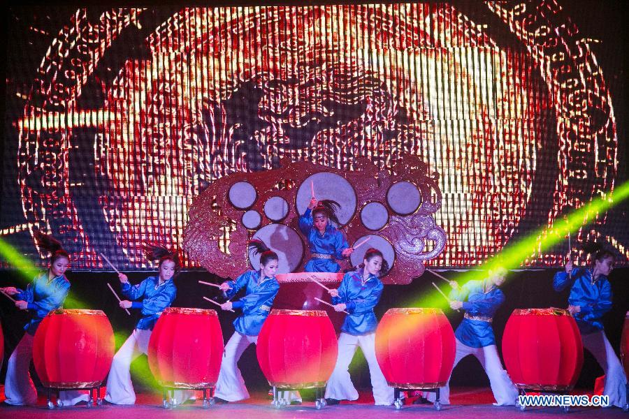 China's female percussion group, Red Poppy Ladies, auditions part of 'Mulan the Musical' for media in New York, the United States, on June 30, 2014. This is the second time the musical be put on stage in New York. [Photo/Xinhua]